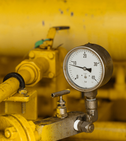 Pressure gauge in oil and gas production process for monitor condition, The gauge for measure in industry job, Industry background and close up gauge. (C) Shutterstock, curraheeshutter